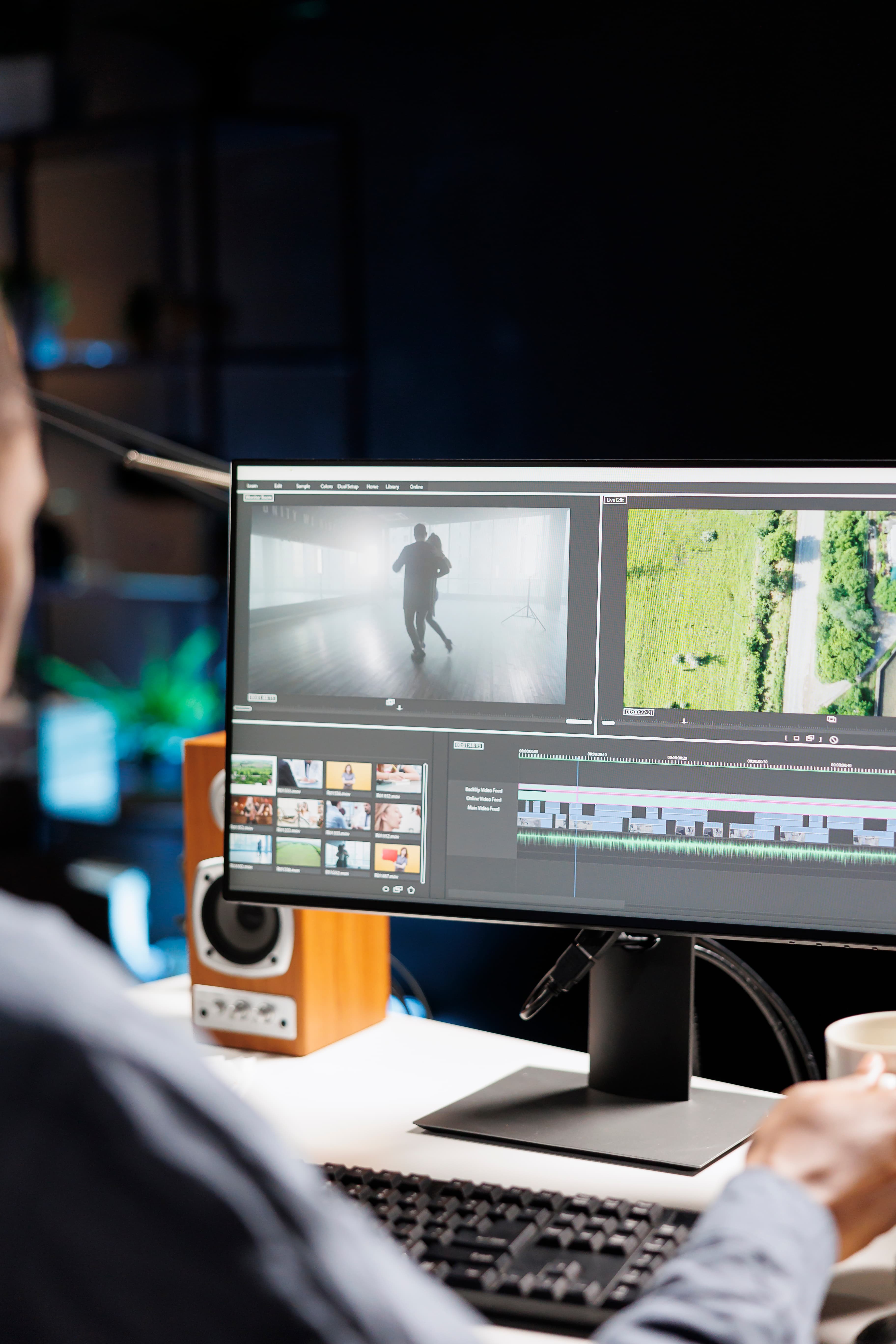 Editor reviewing a film timeline on a studio monitor